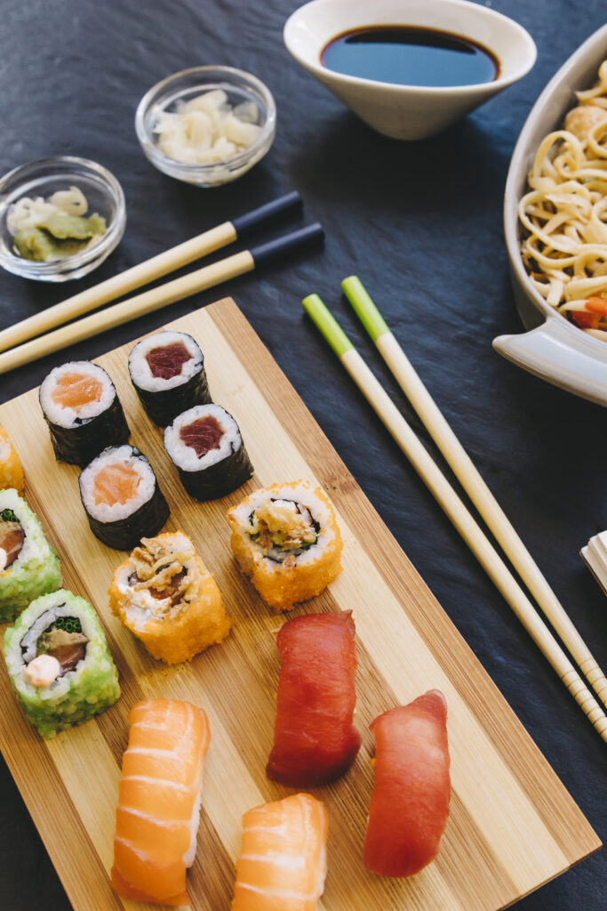 from sushi near chopsticks condiments